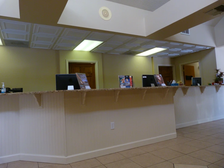 an empty counter in the middle of a tiled area