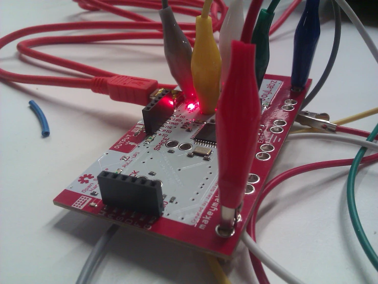a rasp board with wires, wires, and a screwdriver