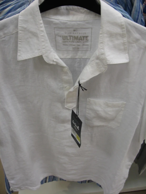 a white on up shirt that has a tag on it