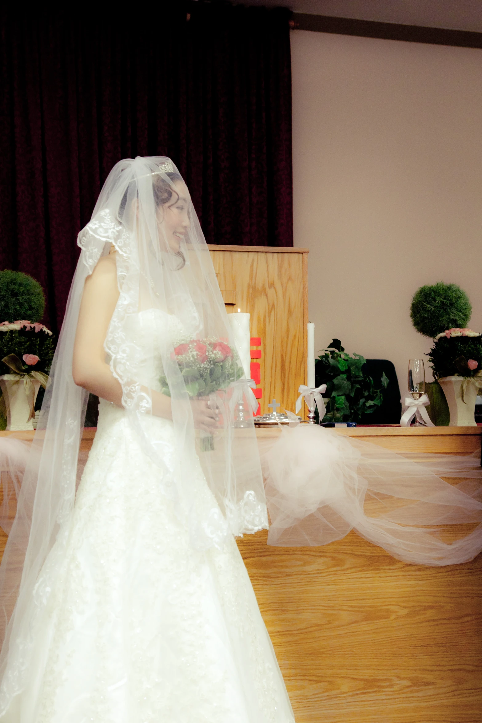 a bride stands in front of her groom