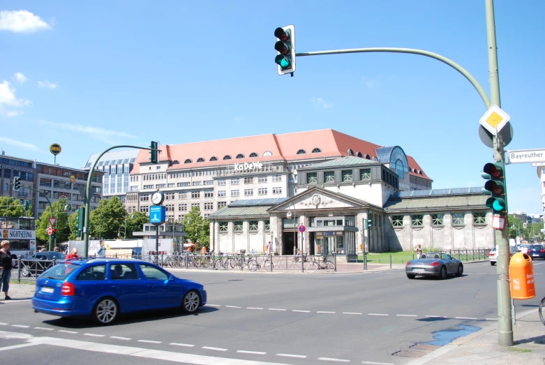 car waiting at traffic light on busy city street