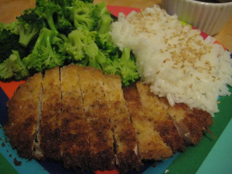 meat on plate with broccoli, mashed potatoes and other foods