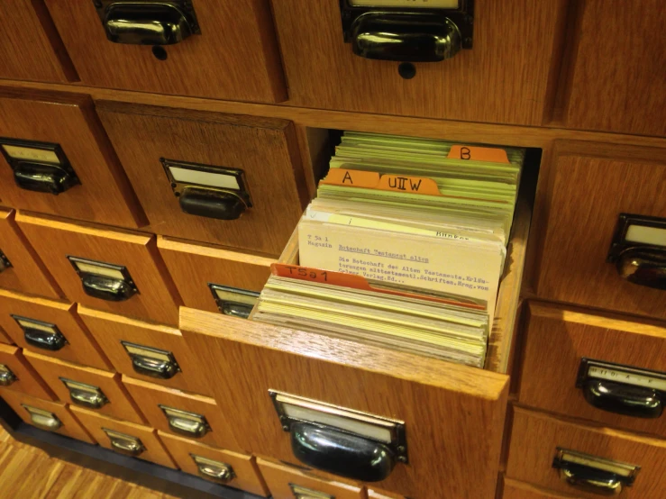 a close up of a filing cabinet with paper