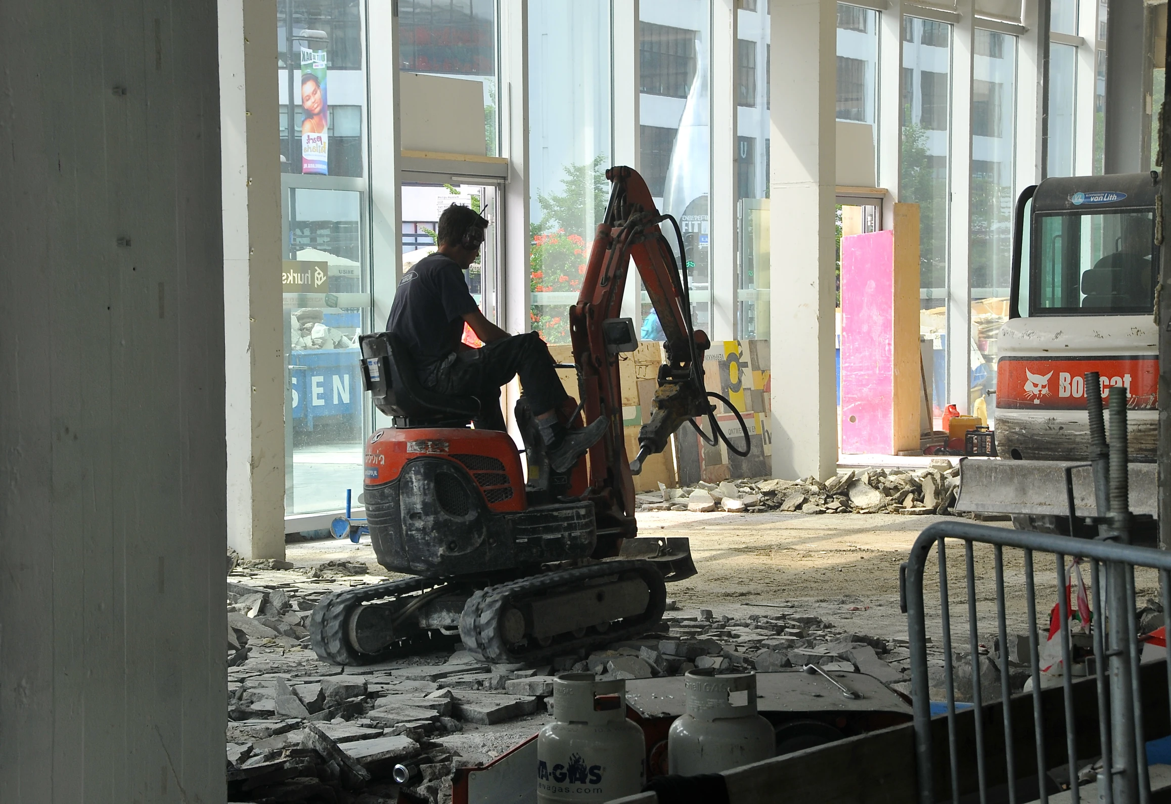 two men are working on a project in the middle of a building