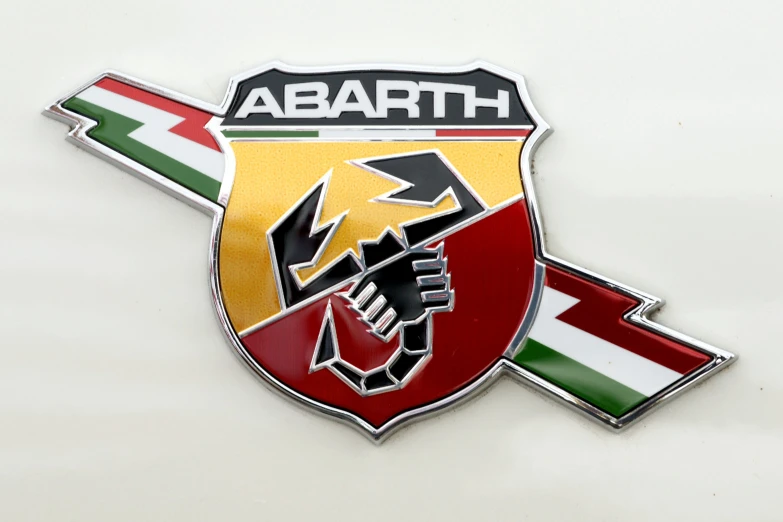 the emblem of a white car with an arrow on it