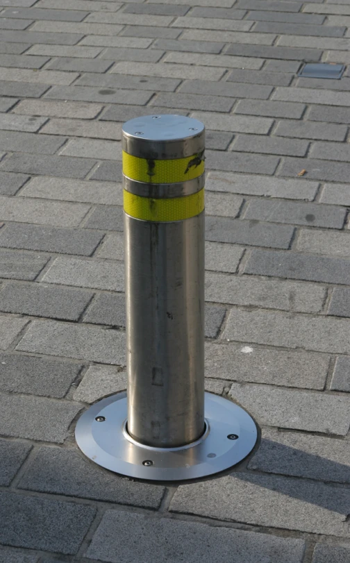 a street pole with a yellow marking strip