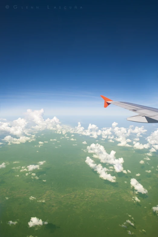 view from inside the airplane on the clouds