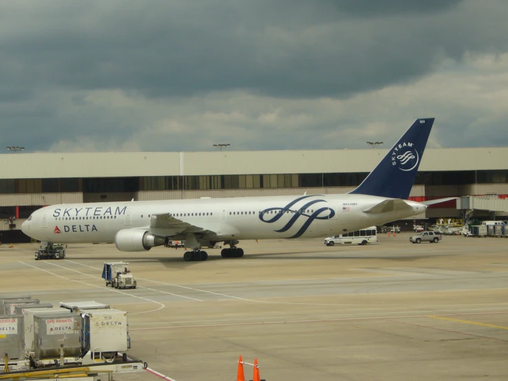 an airplane at the airport on an overcast day