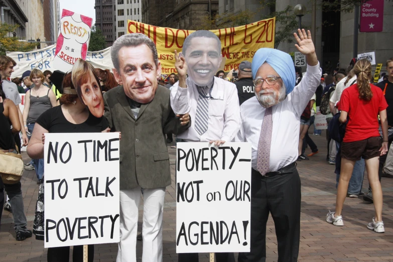 protesters wearing political protest attire, holding signs