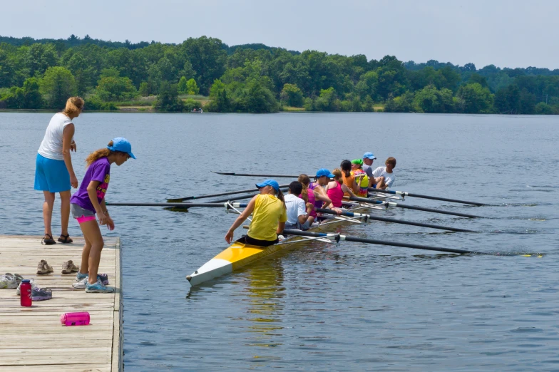 several rowing team members are lined up in row