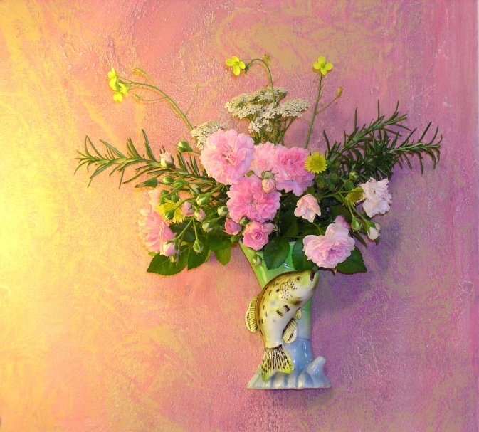 a vase filled with lots of flowers on a wall