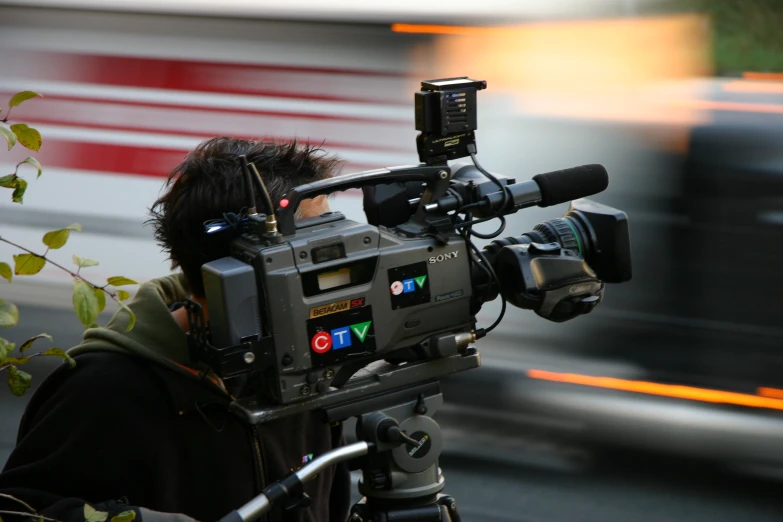 a camera being used for the tv camera on a tripod