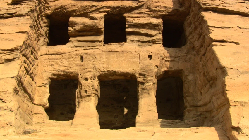 the shadow of a cliff dwelling in stone walls