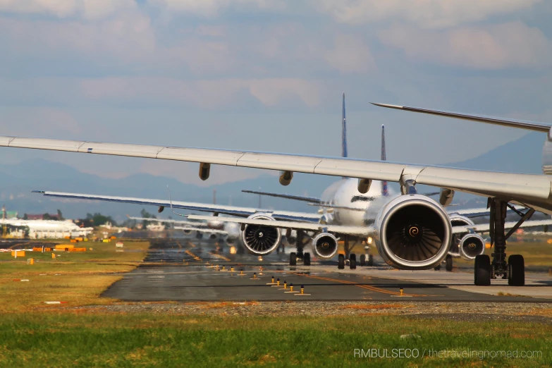 a commercial airplane sitting on an airport runway