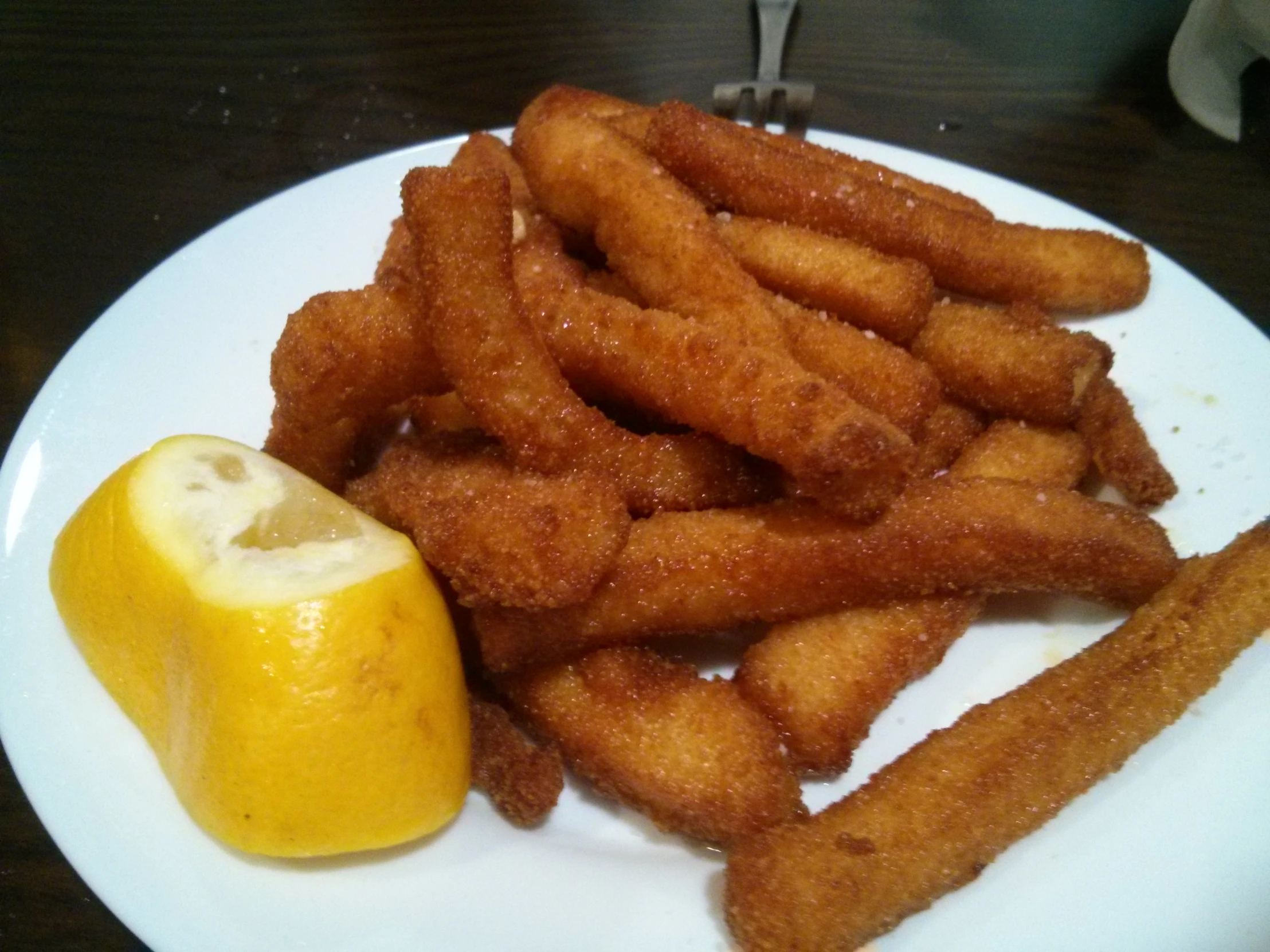 a white plate topped with fries and an apple