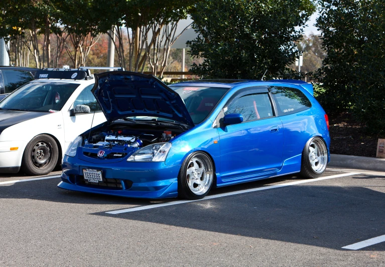 a parked car with its hood open