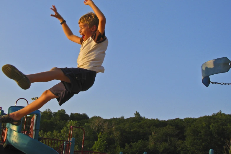 a  is jumping up on a trampoline