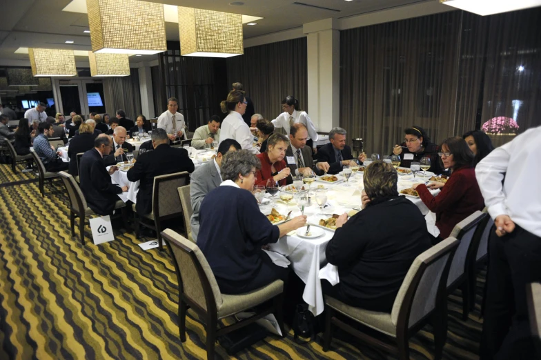 a large group of people dining at tables