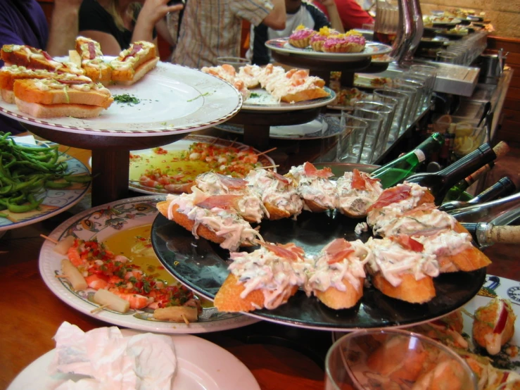 various foods arranged in plates in a large buffet