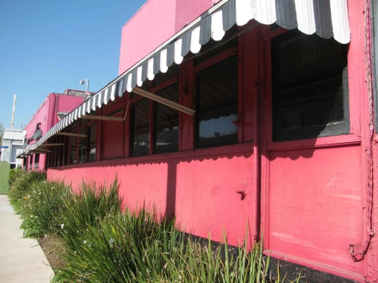 red building in the sunlight on a sunny day