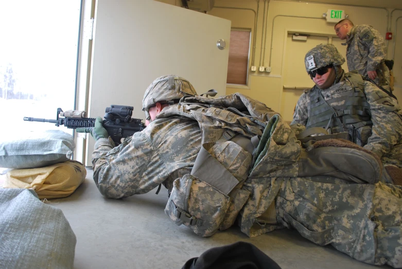 two soldiers sitting on the floor next to each other