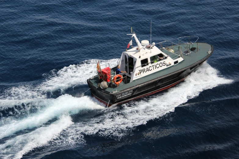 a black and white boat out on the ocean