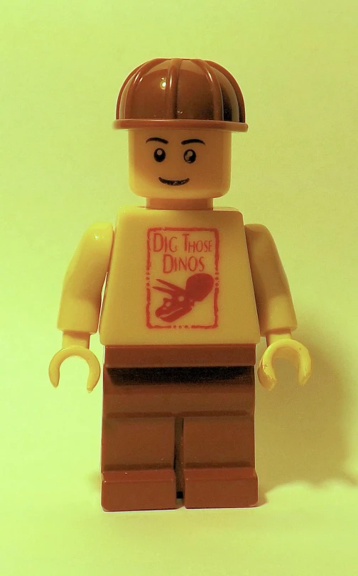 a lego figure has a helmet and a red sticker on it