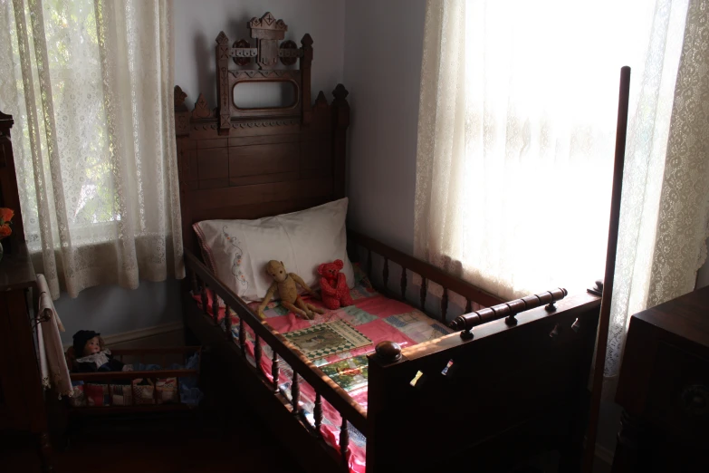 a crib in a small child's bedroom with toys