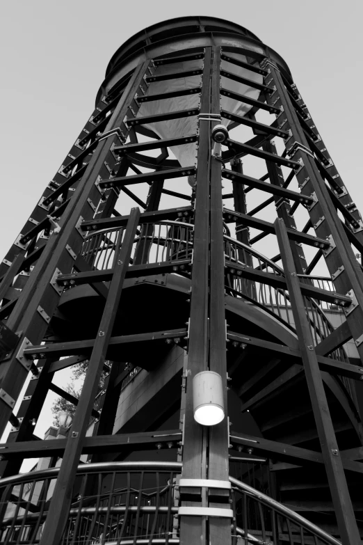 a clock tower with lights is shown in black and white