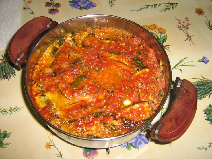 this is a stew in a pot with several garnishments