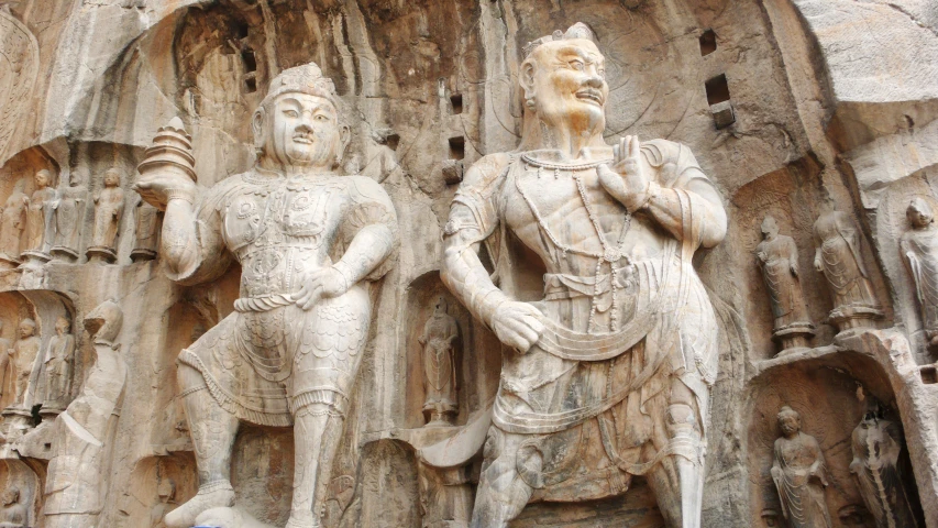 sculptures at the entrance to a building with stone carved figures