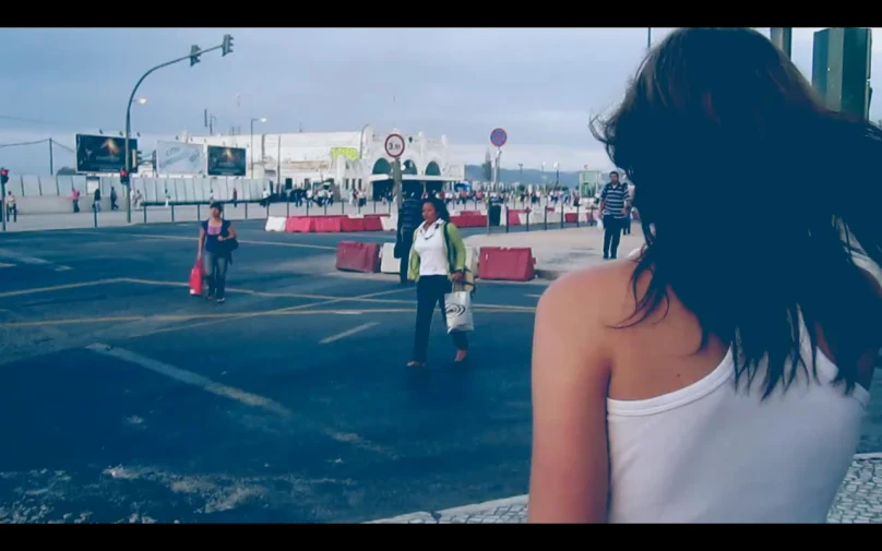 people are walking through an empty parking lot