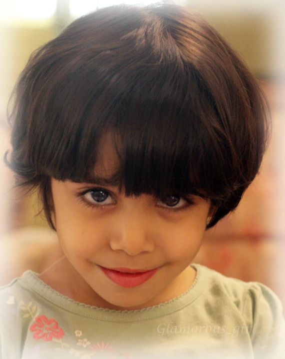 a close up of a young child's face