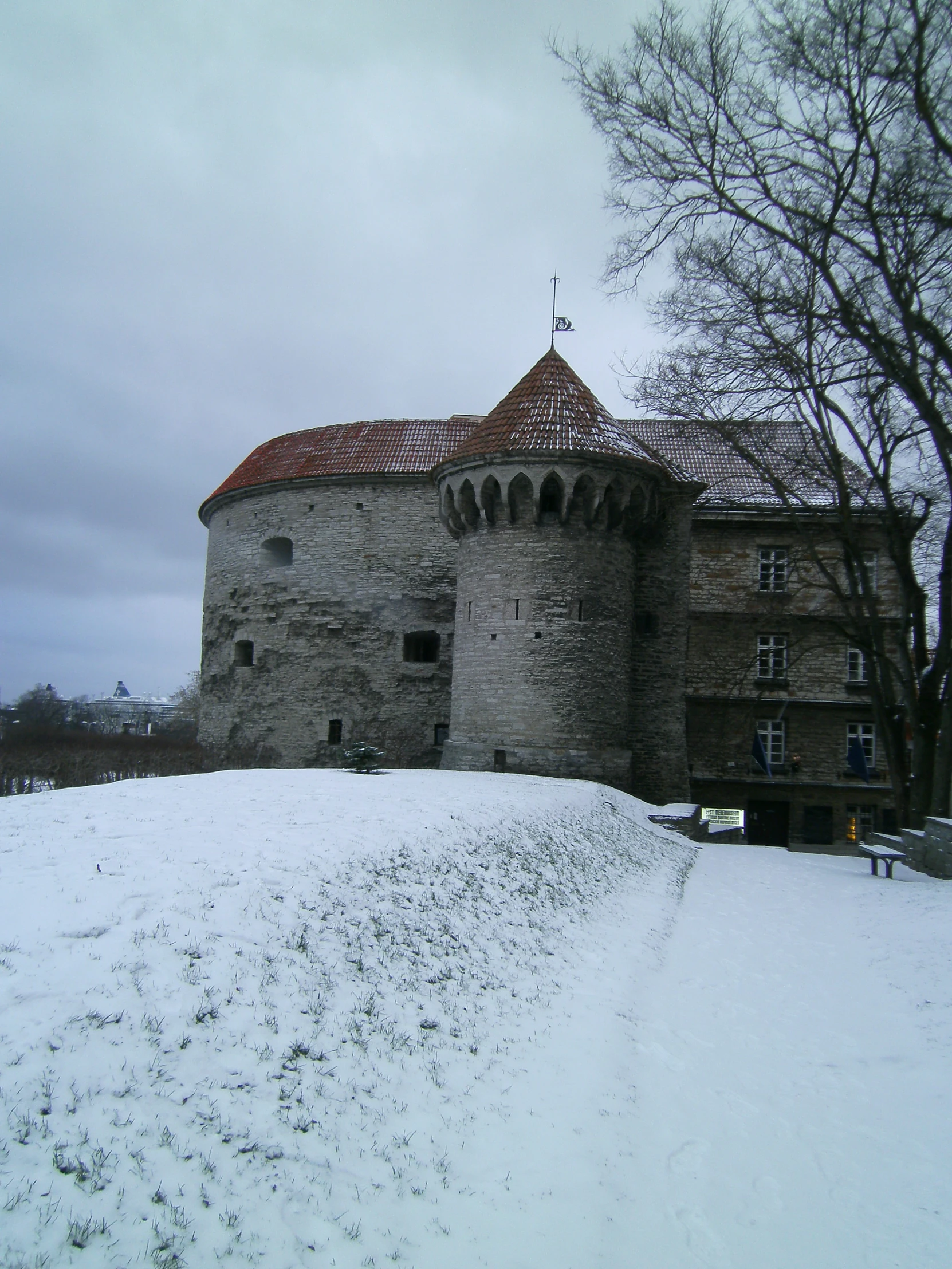 an old building that is in the snow