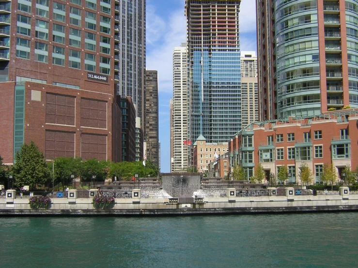 several city skyscrs on a stretch of river