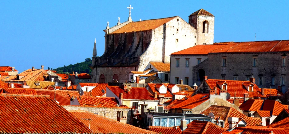 the view of a city in croatia with red tile roofs