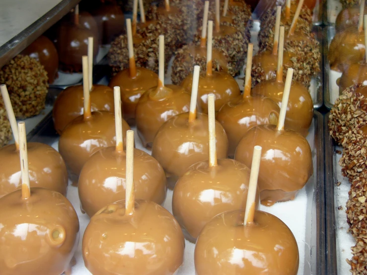 a table topped with chocolate apples and sprinkles