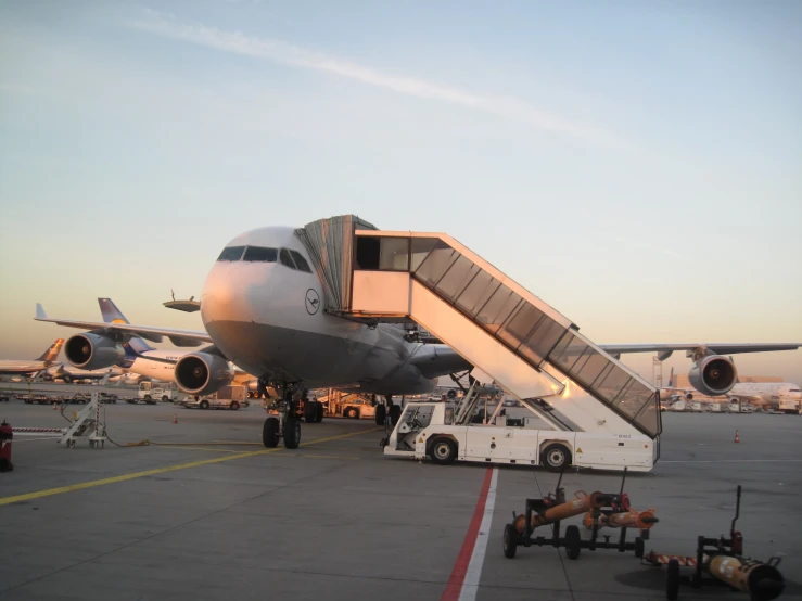 a large commercial airplane sits on the runway as it comes down