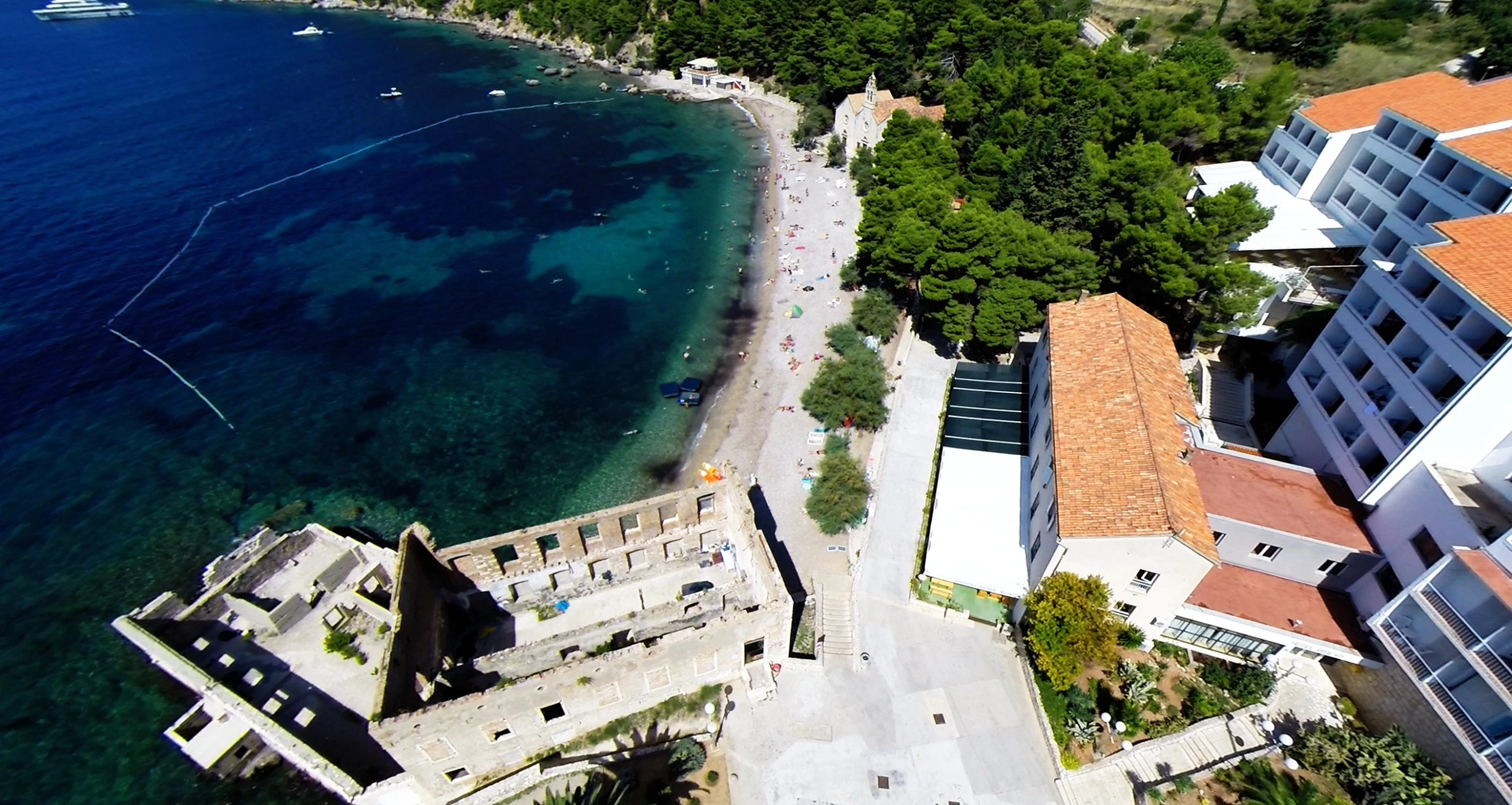 an aerial view of a beach area in a town