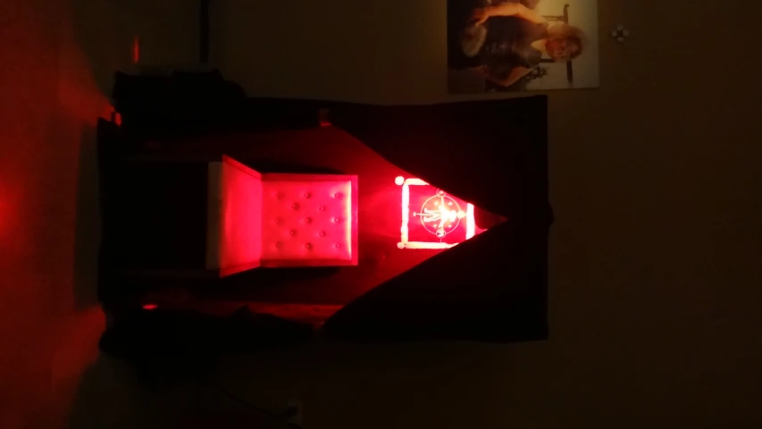 a lit up chair sitting in the middle of a room