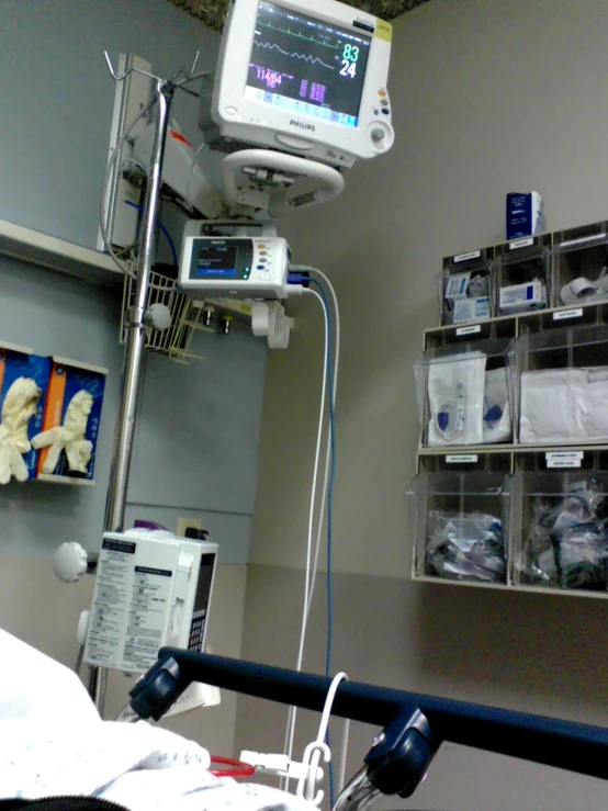 an in operating room with medical equipment and hanging racks