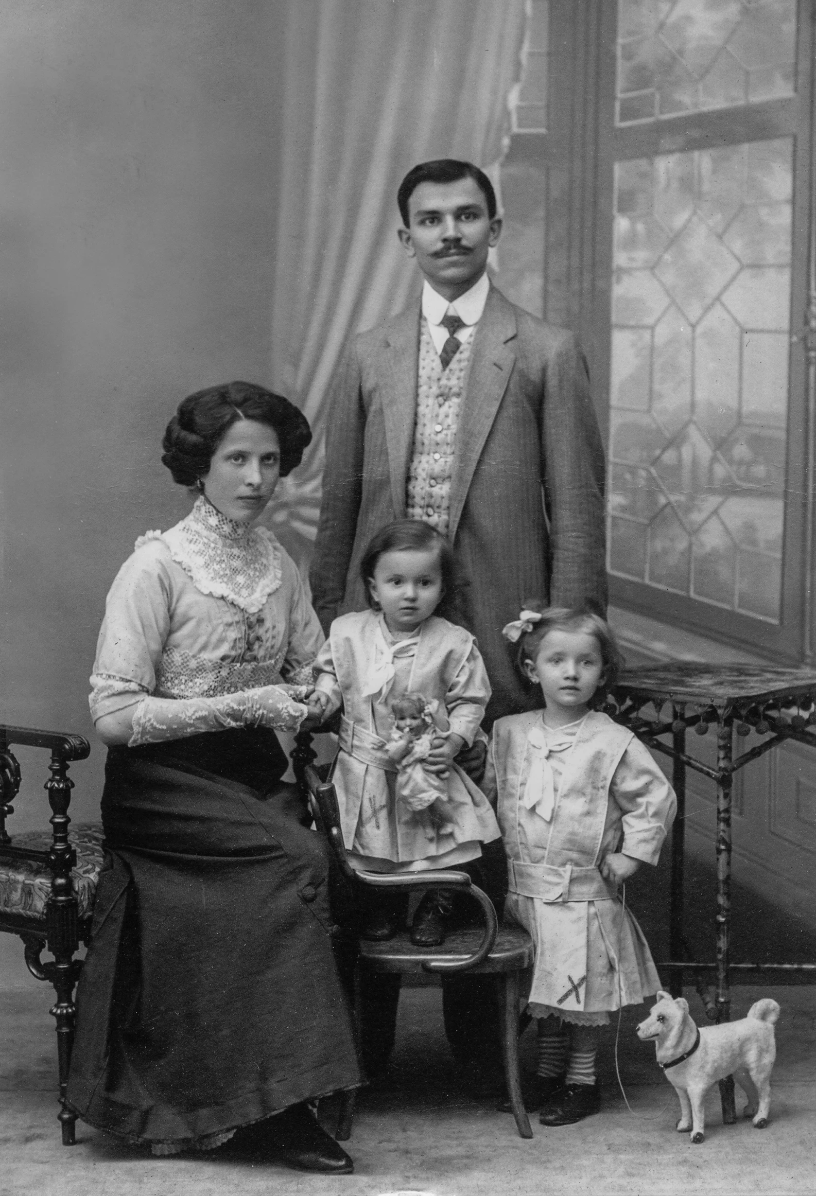 black and white pograph of three adults and two children