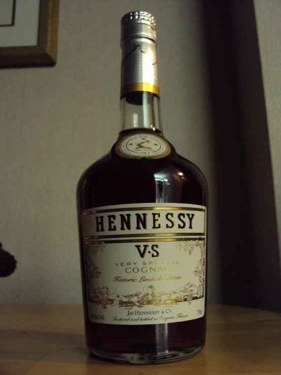 a bottle of hennessy vs cogna on a table