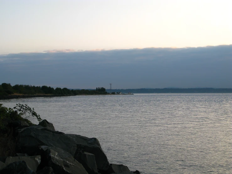 a body of water next to a large island