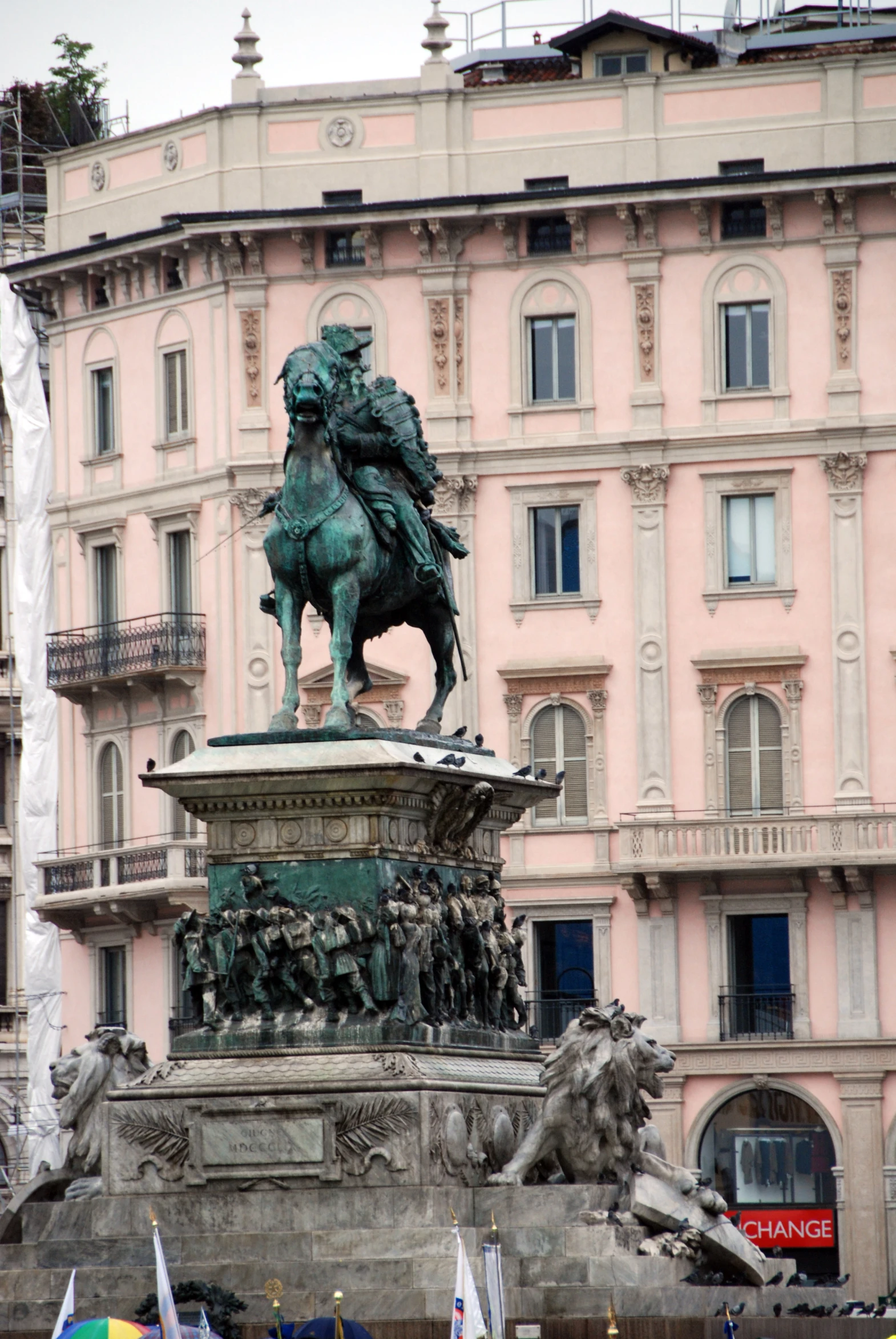 a statue of a horse in the center of a square