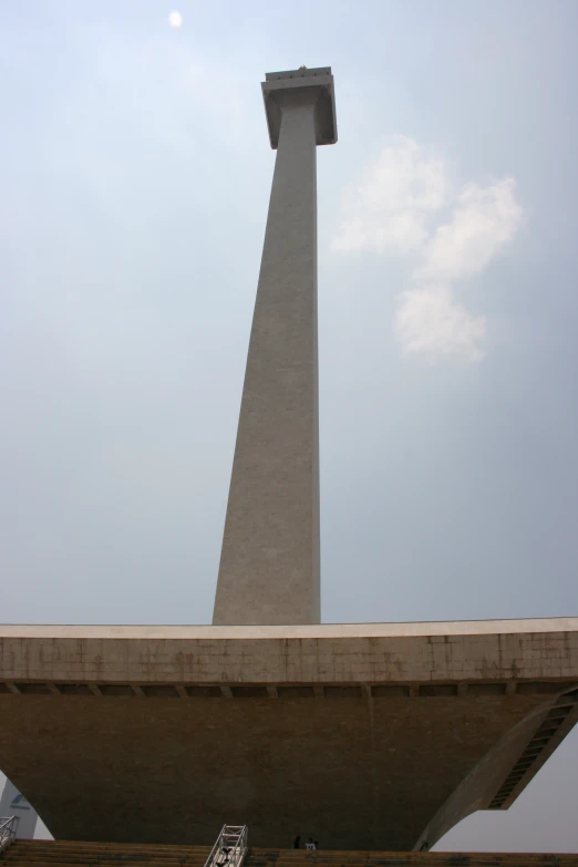 a po looking up at the clock tower on top of a building