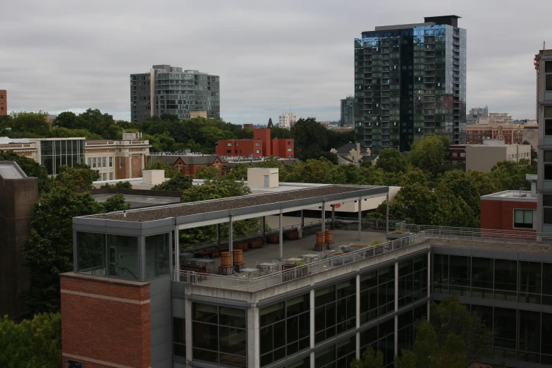 an outdoor bar sits next to the city