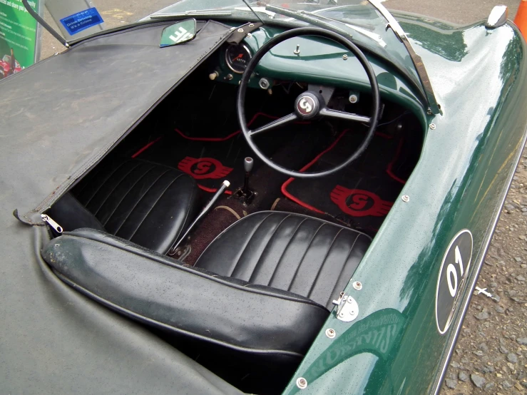 an image of an old sports car with seats inside