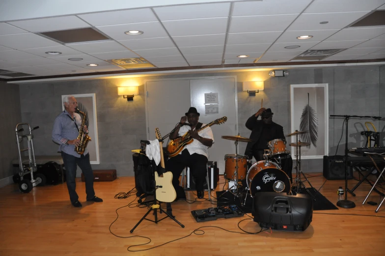 a group of people with guitars and bassets