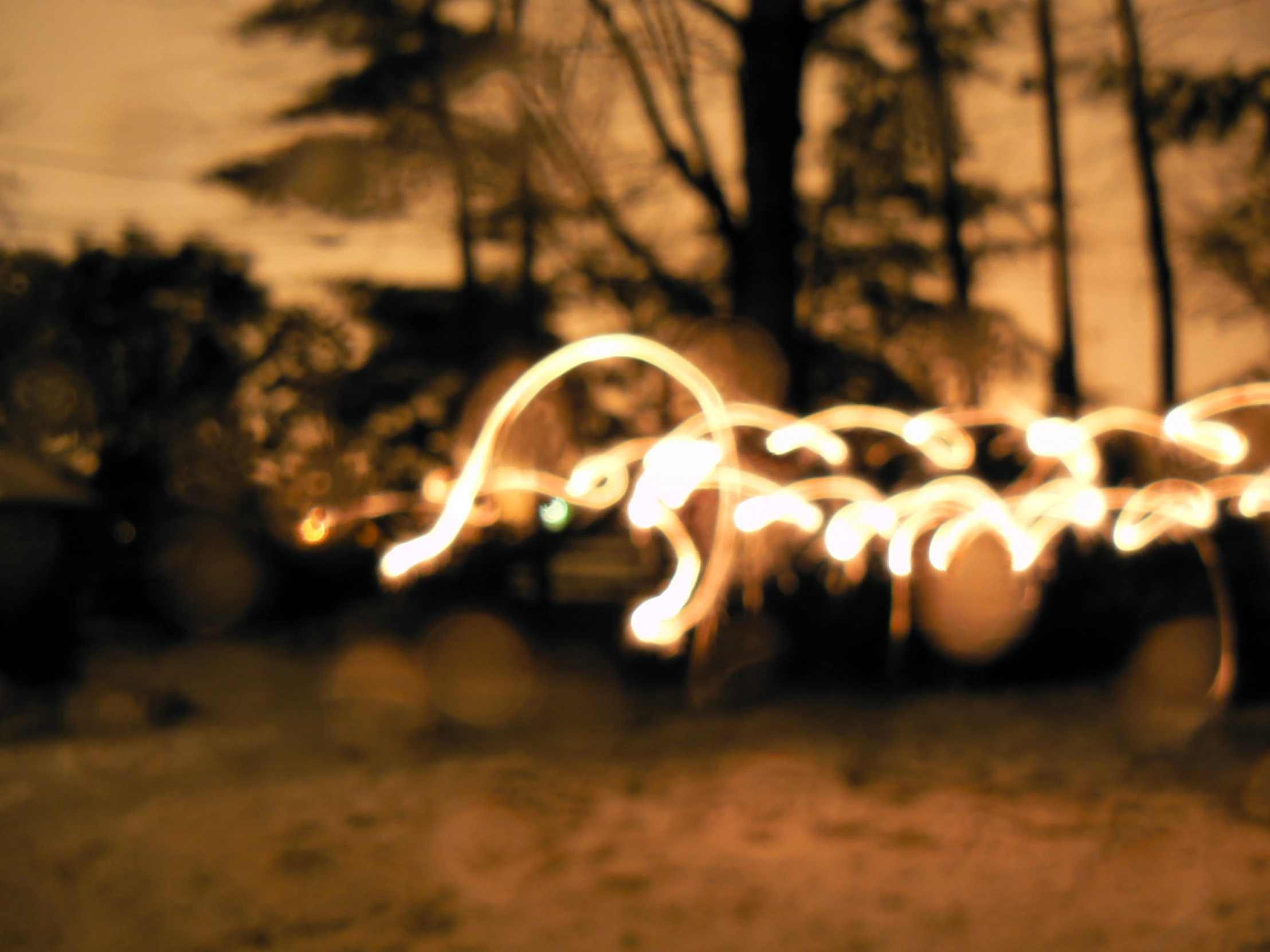 a blurred po of lights sitting on top of a street